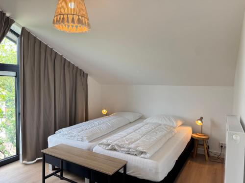Katil atau katil-katil dalam bilik di LouLou Beachhouse