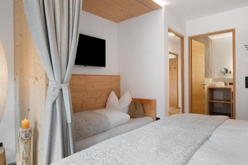 Ein Bett oder Betten in einem Zimmer der Unterkunft Schartenblick