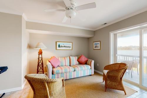 a living room with a couch and chairs at Bethany Marina ---37845 Salt Grass Cove #92 in Ocean View