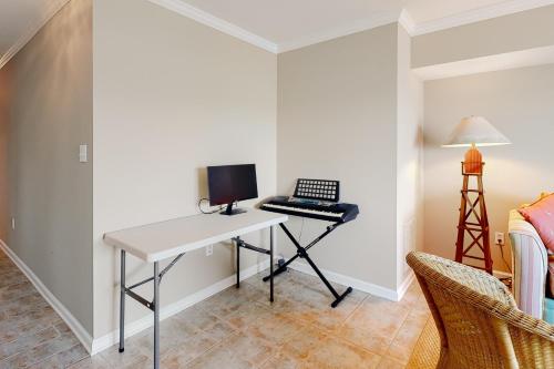 a desk with a computer on it in a room at Bethany Marina ---37845 Salt Grass Cove #92 in Ocean View