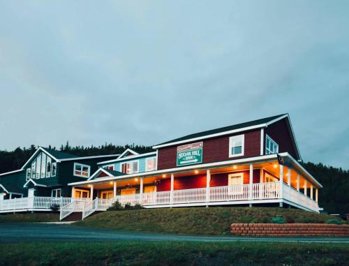 a large building with lights on the side of it at Sugar Hill Inn in Norris Point