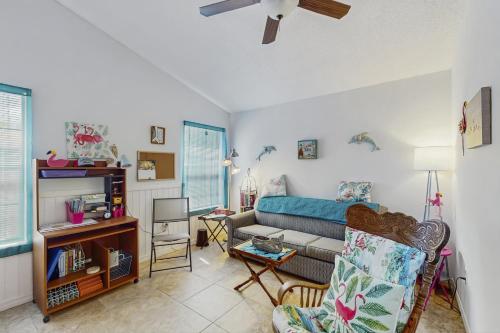 a living room with a couch and a table at Endless Summer in Sebastian