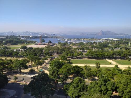 a view of a park with trees and a body of water at Diamond Hotel in Rio de Janeiro