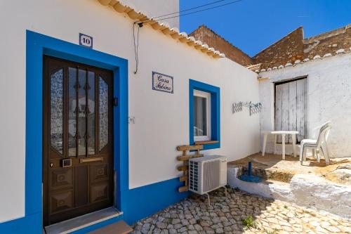 a house with a blue and white door at Casa Sabino in Almádena