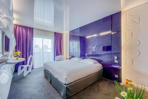 Postel nebo postele na pokoji v ubytování Comfort Aparthotel Bassin d'Arcachon