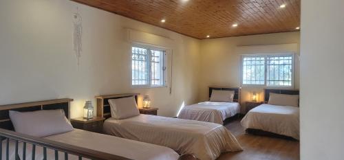 En eller flere senge i et værelse på Romana