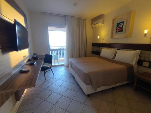 Postel nebo postele na pokoji v ubytování Hotel Torres da Cachoeira