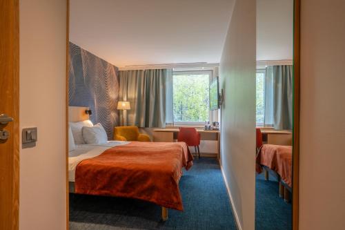 Postel nebo postele na pokoji v ubytování ProfilHotels Aveny