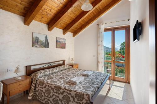 Ένα ή περισσότερα κρεβάτια σε δωμάτιο στο Villa Degli Dei