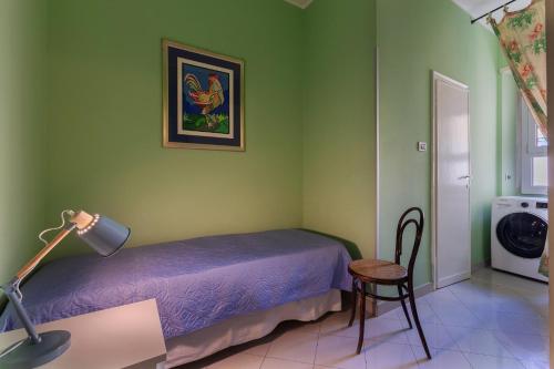 a bedroom with a bed and a desk with a lamp at Mercato delle Erbe Big Apartment in Bologna