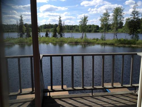 a view of a lake from a porch at Sammuli Holiday Village in Viljandi