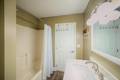 a bathroom with a shower and a sink and a mirror at Windy Hill Villa 1 - Beach Barnacle in Myrtle Beach