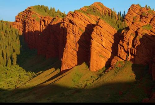 a view of a rock formation in a canyon at Yurt Camp Town of heavenly mountains " Kyz Zhibek" in Dzhetyoguz