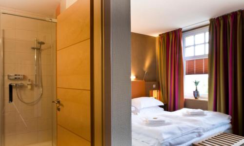 Postel nebo postele na pokoji v ubytování SONN'IDYLL Aparthotel