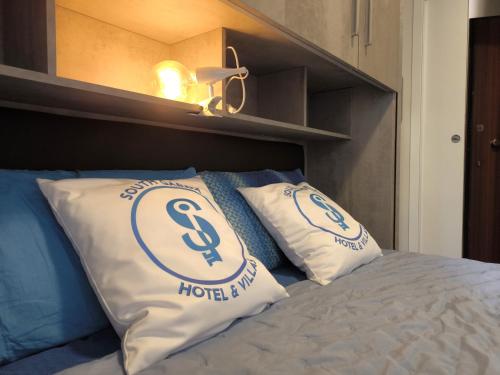 Ένα ή περισσότερα κρεβάτια σε δωμάτιο στο SG Family - Dogana Oasis