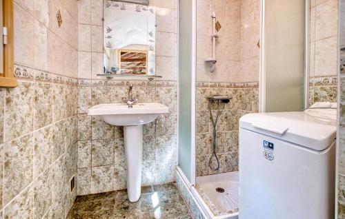 a bathroom with a sink and a toilet at Stunning Home In Plazac With Wifi in Plazac