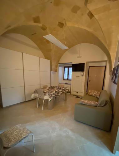 a large room with a table and chairs at Casina Massari in Francavilla Fontana