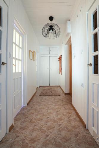 a hallway with white walls and a ceiling at Apartament Danusia in Kołobrzeg