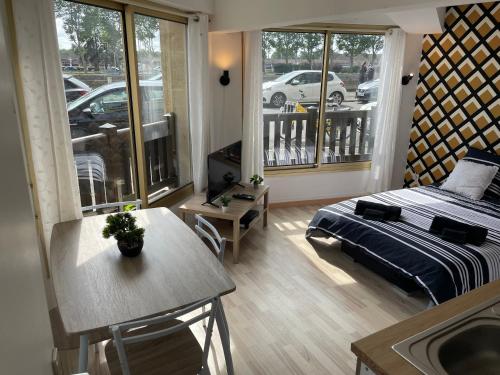 Ένα ή περισσότερα κρεβάτια σε δωμάτιο στο Studio 23m2 5mn gare 3 couchages