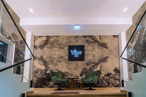 TV a/nebo společenská místnost v ubytování ARIS Boutique Hotel & SPA