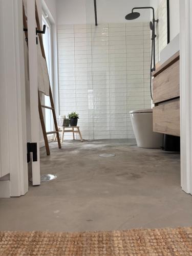 a bathroom with a tub and a sink and a bath tub at Casas do Mercado, 5 in Montemor-o-Novo