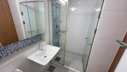 a bathroom with a sink and a glass shower at 4-3025 #GangnamStation, 5mins #K-Pop #Yeoksam, 3mins #Neflix #K-food #Seoul in Seoul
