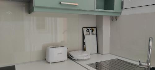a kitchen with a toaster sitting on a counter at Panorama View in Agios Stefanos