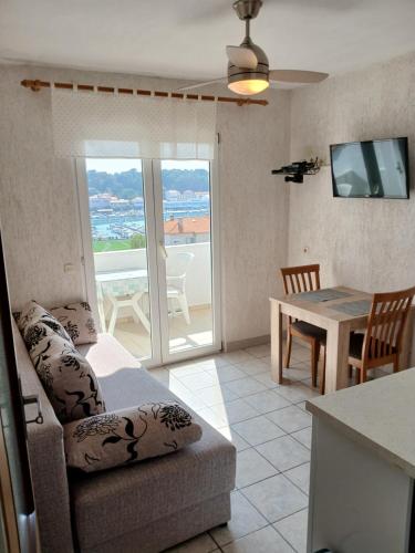 a living room with a couch and a table at Piadora in Banjol