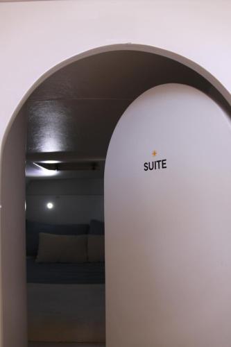 a white room with a bed in the background at The Sailor Charter in Portimão