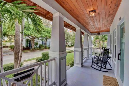 a porch with a wooden ceiling at Grey Mist - Recharge in a Stylish Home Near Downtown in West Palm Beach