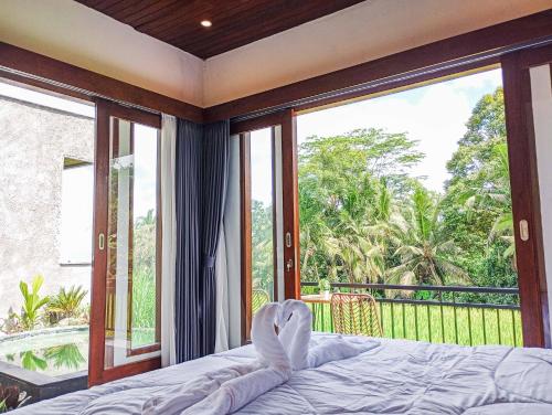 Katil atau katil-katil dalam bilik di Umah Geina Ubud