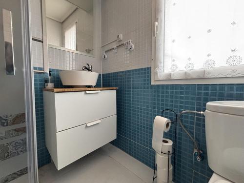 a bathroom with a sink and a toilet at Ortuella Apartment in Ortuella