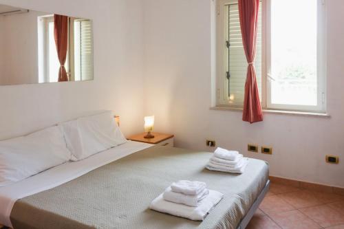 Postel nebo postele na pokoji v ubytování Vbeb Macrame Rooms Agrigento