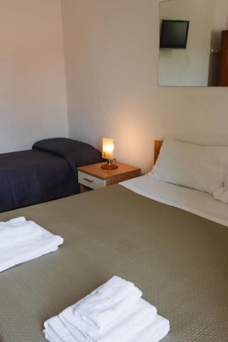 Postel nebo postele na pokoji v ubytování Vbeb Macrame Rooms Agrigento