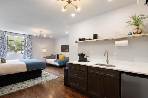 a kitchen with a bed and a sink in a room at King Suite and Twin Boutique Hotel 2 Floor in Savannah