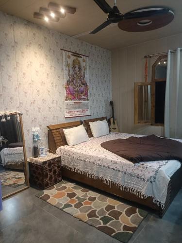 Voodi või voodid majutusasutuse Raj guest house toas