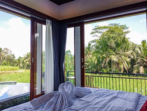 Katil atau katil-katil dalam bilik di Umah Geina Ubud