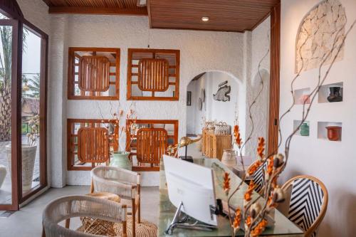 a dining room with a table and chairs at Casa Maddu in Tegalalang
