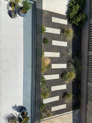 an overhead view of a glass building with plants at Villa Vida, Medulin - Bazen i jacuzzi in Medulin