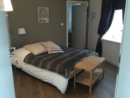 Una cama o camas en una habitación de Chambres d'hôtes - L'Ecurie Obernai