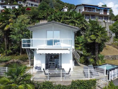 an aerial view of a house with a swimming pool at Casa Samara in Cannobio