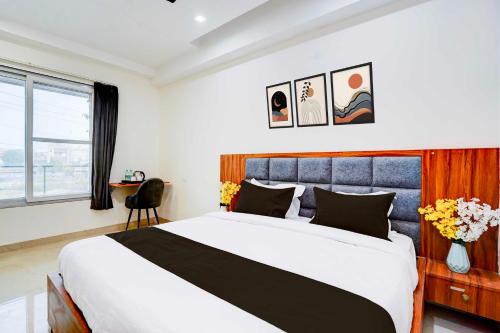 a bedroom with a large bed in a room at Collection O Sector 93 Noida Expressway in Noida