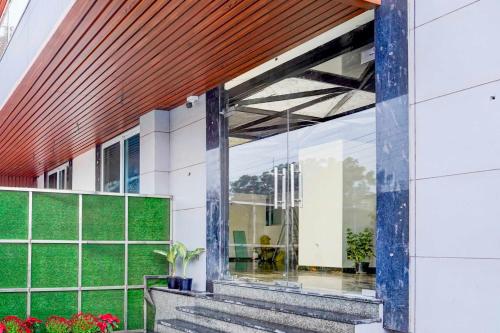 an external view of a building with a large window at Collection O Sector 93 Noida Expressway in Noida