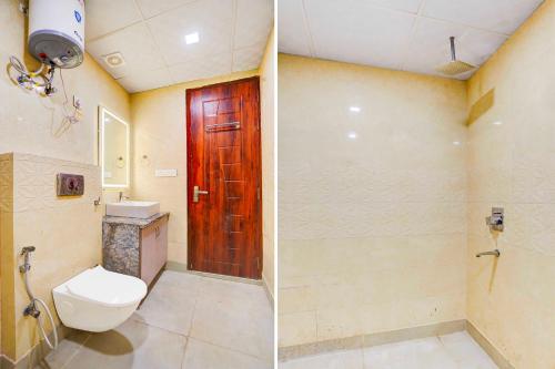a bathroom with a toilet and a wooden door at Collection O Sector 93 Noida Expressway in Noida