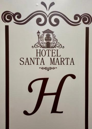 a sign for a hotel in santa marta at Hotel Santa Marta Centro Histórico in Popayan
