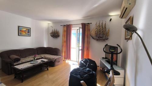 a living room with a couch and a table at Stella Maris - Family Apartment in Polače