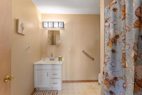 a bathroom with a sink and a shower curtain at 219 W Chestnut Ave in North Wildwood