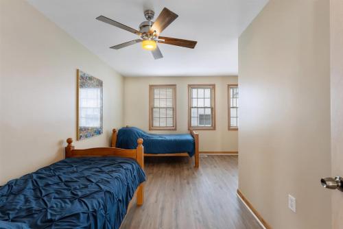 a bedroom with a bed and a ceiling fan at 219 W Chestnut Ave in North Wildwood