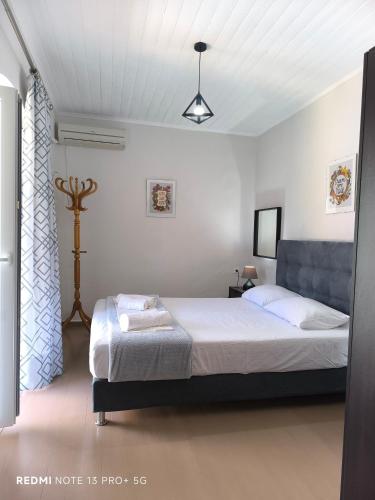 a bedroom with a bed in a room at Poseidon Apartments in Gaios