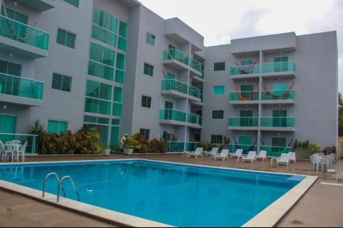 een zwembad voor een gebouw bij Maragogi-Peroba Ville Residence03 in Maragogi